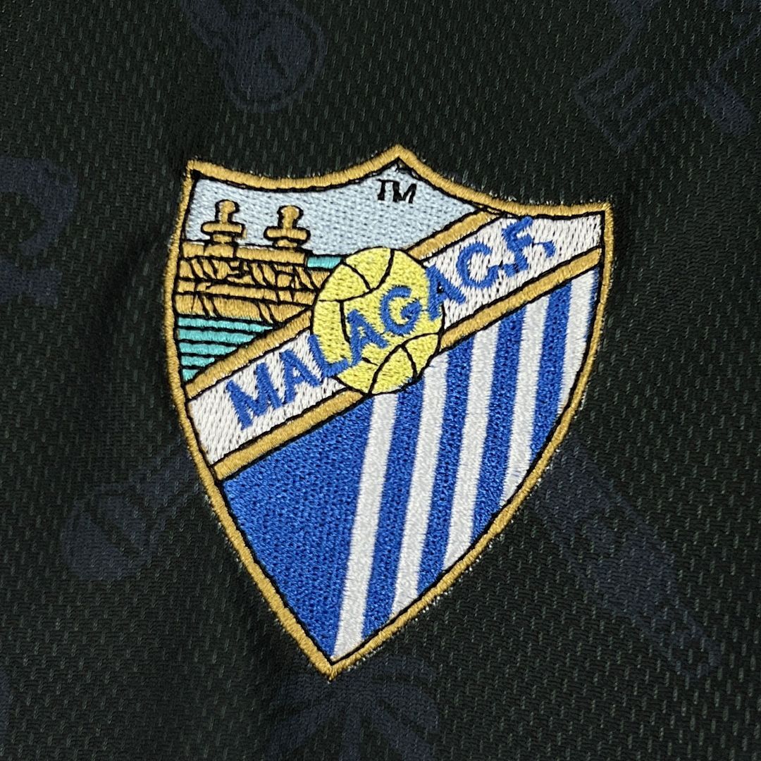 Málaga Legado 2025/26 maglia retro nera oro