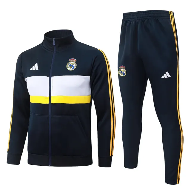 Real Madrid 2026/27 tuta blu navy fascia bianca gialla