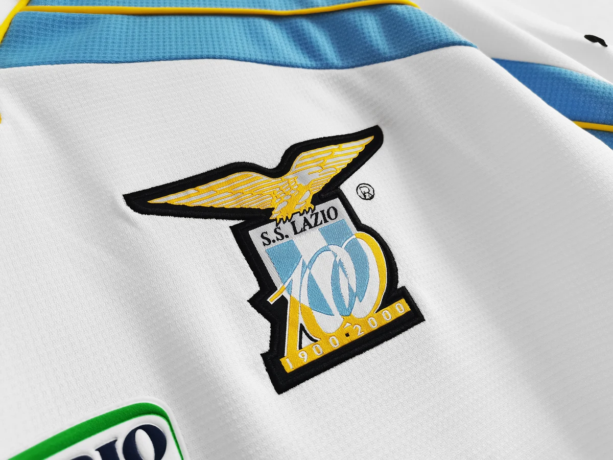 Tifoso Store Maglie da Calcio Maglia Lazio Centenario 1999/2000 bianca