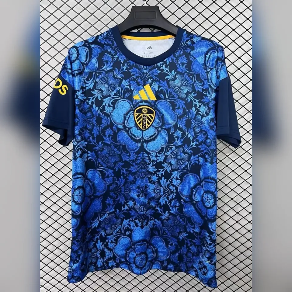 Leeds United 2026/27 maglia prepartita blu floreale